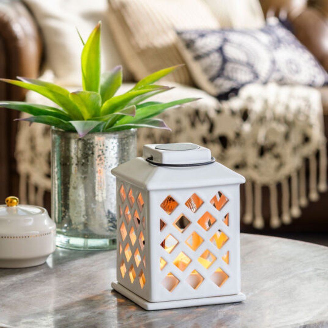 Lampada bianca con diffusore per cere e oli